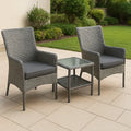Set da Giardino in Rattan Sintetico con Tavolo in Vetro e Sedie con Cuscini Grigi